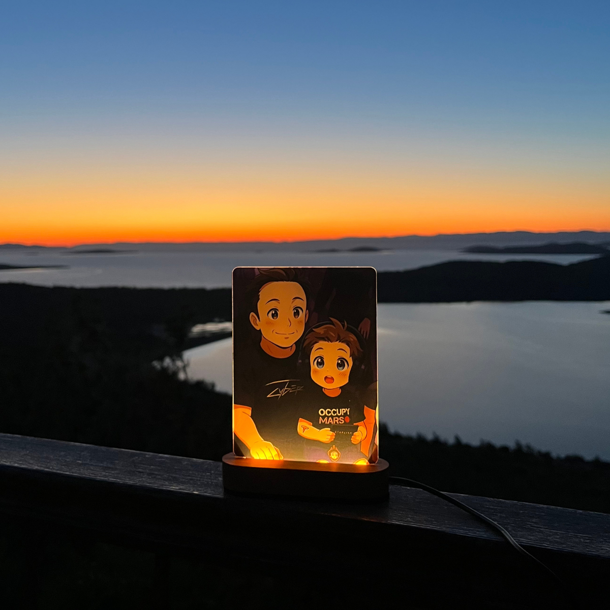 Custom animated photo night light glowing on a wooden LED base