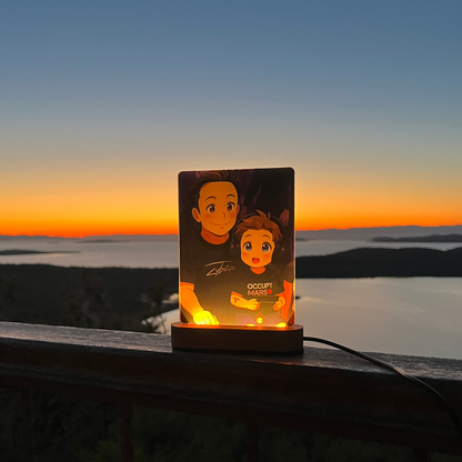 Custom animated photo night light glowing on a wooden LED base