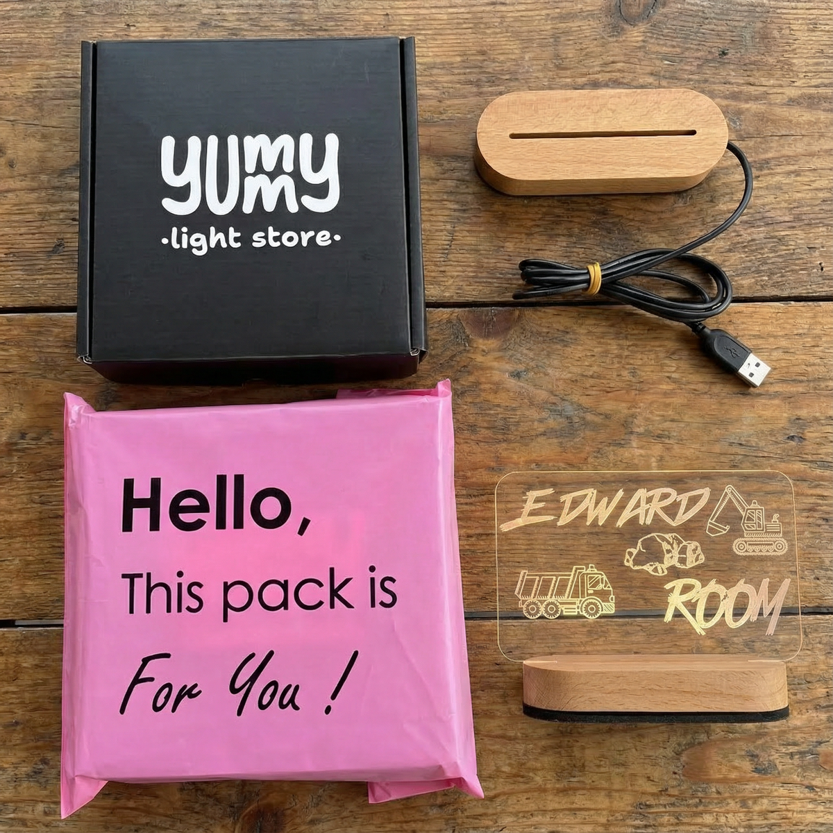 Packaging and items from Yumy Gift Store on a wooden surface