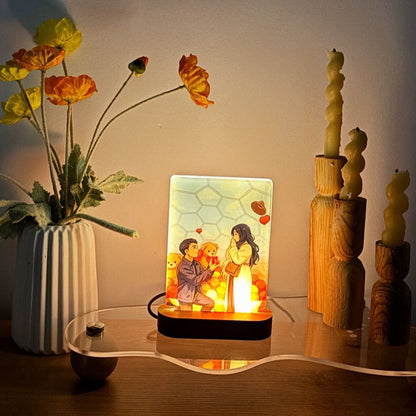 Custom animated photo night light glowing on a wooden LED base